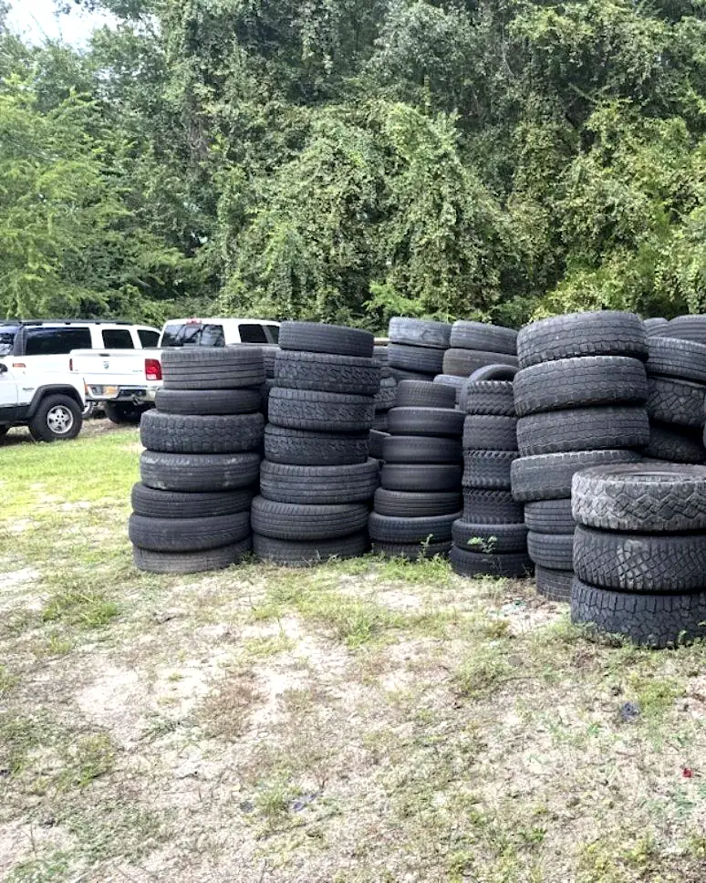 Stacked tires at a property cleanup