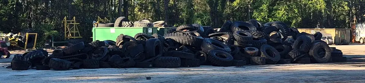 Large mixed pile of tires awaiting removal